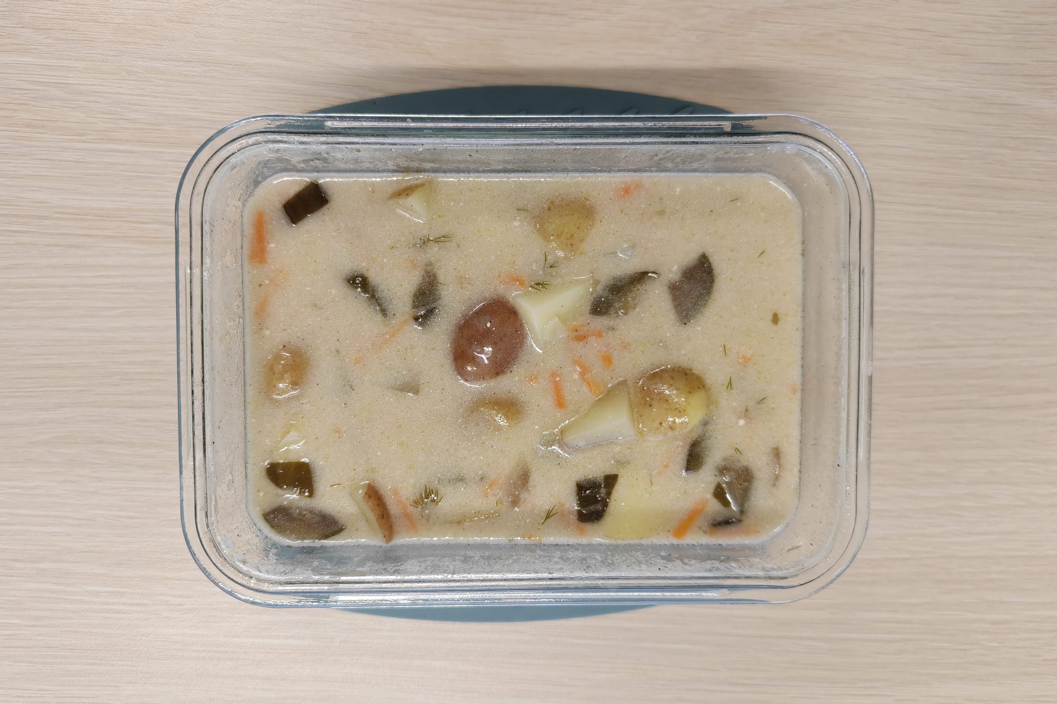 Pickle soup with potatoes and shredded carrots.